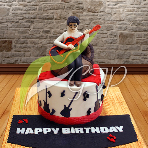 Rock & Roll Cake - A delicious chocolate cake with chocolate frosting and a fun rock and roll theme, perfect for celebrating any occasion. Available for delivery to Pakistan with GiftstoPakistan.