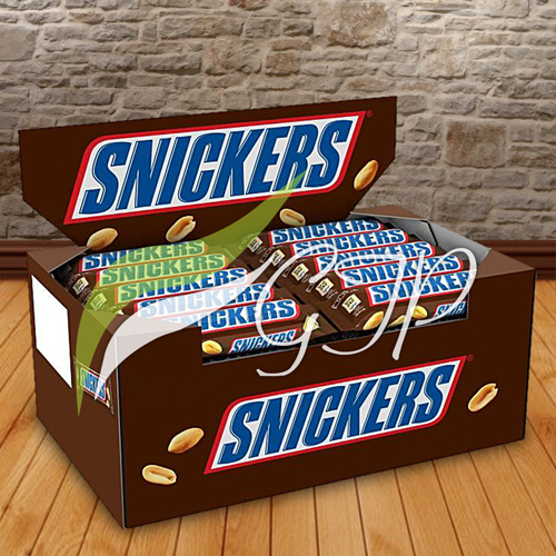 A close-up image of a Snickers Chocolate Box, featuring multiple Snickers bars arranged neatly in a cardboard box.