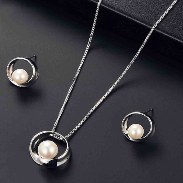 Silver necklace with earrings featuring lustrous pearls, a perfect gift for loved ones in Pakistan